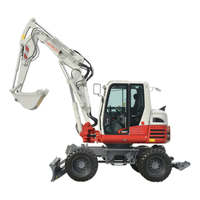 pelle takeuchi TB295W sur pneus travaux publics et batiment